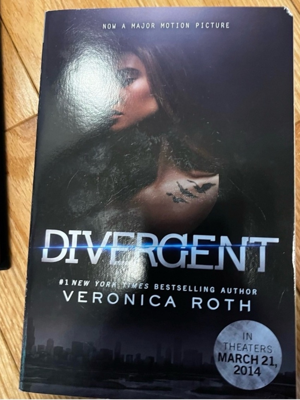Divergent by Veronica Roth. Black Hardcover Book